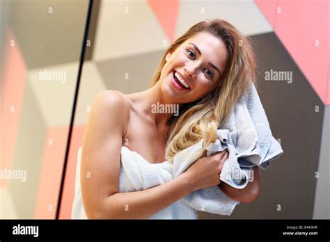 Beautiful Blonde Caucasian Woman Posing In Bathroom With Wet Hair Stock Photo Alamy