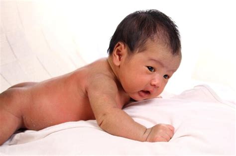 Premium Photo Naked Newborn Baby Girl In Face Down Position