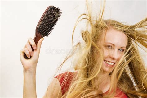 Blonde Girl Long Blowing Hair Holds Natural Bristles Brush Stock Photo Image Of Tangled
