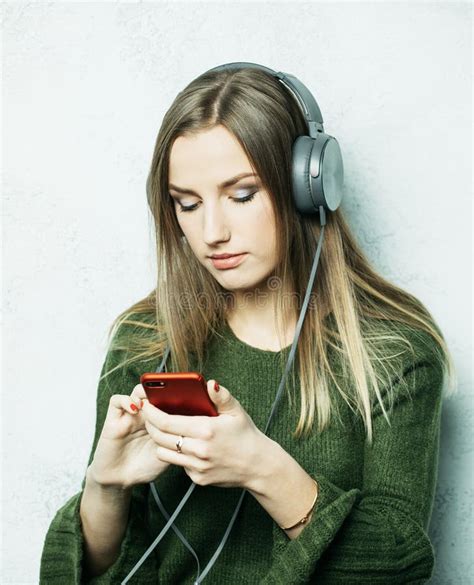 People And Technology Concept Happy Woman In Headphones Listening To