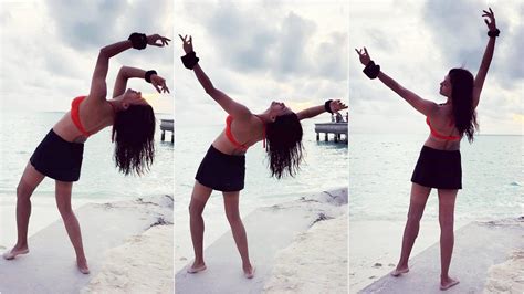 Sushmita Sen Flaunts Her Toned Body In A Scarlet Bikini Halter Top And Mini Skirt