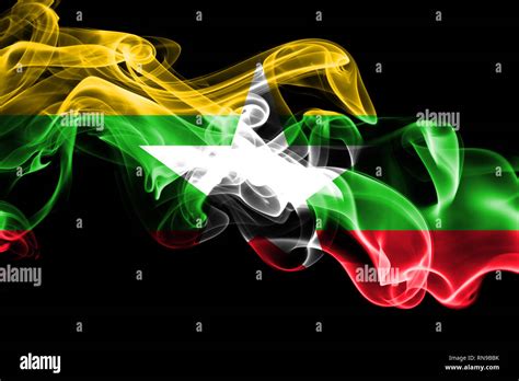 National Flag Of Myanmar Made From Colored Smoke Isolated On Black Background Abstract Silky