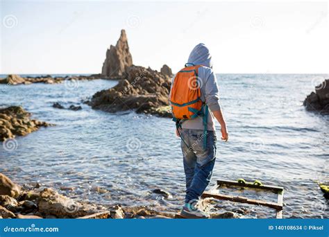 Man Exploring Spanish Coastline Stock Photo Image Of Admire Beach