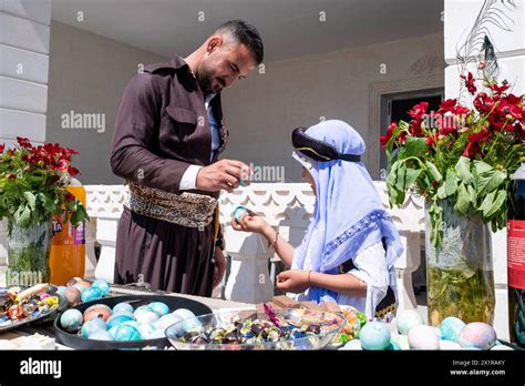 A Father And His Daughter Are Playing With Colored Eggs Carsema Sor