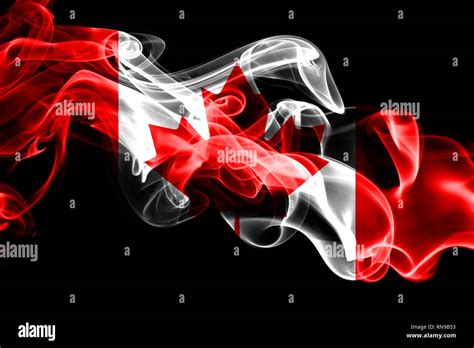 National Flag Of Canada Made From Colored Smoke Isolated On Black Background Abstract Silky