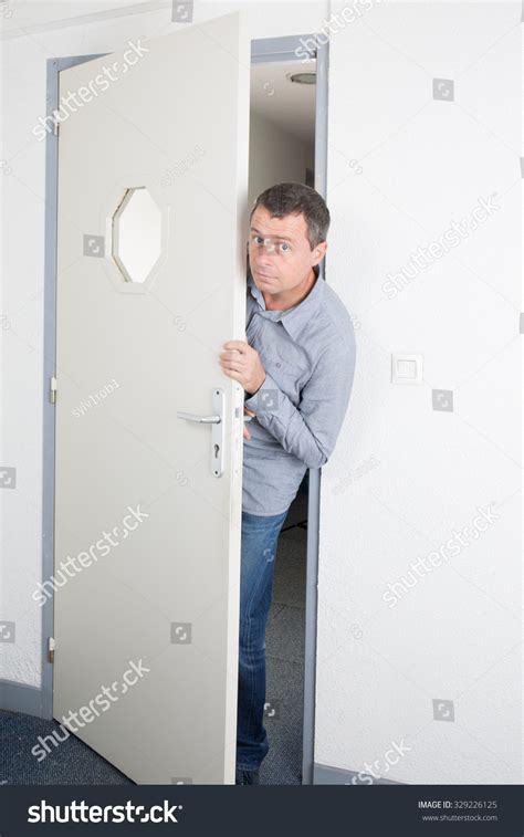 Man Opening A Door