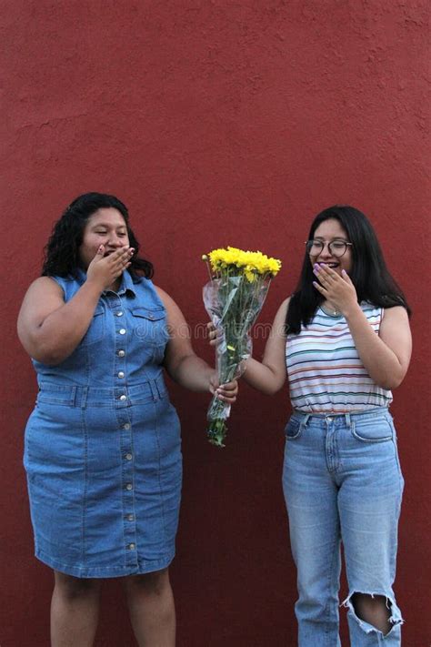 Latina Sisters And Friends Brunettes Give Each Other Yellow Flowers To Show Their Love And The