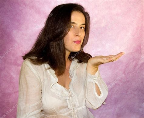 Brunette Girl Blowing A Kiss Stock Photo TTLmedia 12140183