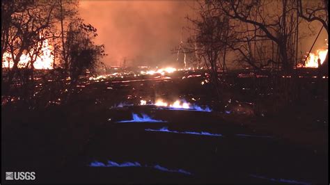 ‘Eerie’ blue flames burn in cracks caused by Hawaii volcano