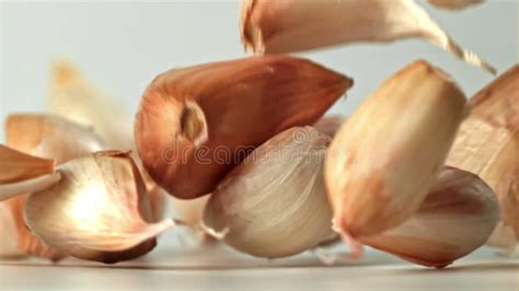 Fresh Garlic Falls On The Table Filmed On A High Speed Camera At 1000