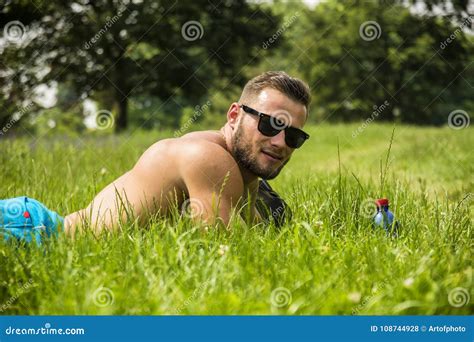 Handsome Muscular Shirtless Hunk Man Outdoor In City Park Stock Photo Image Of Naked