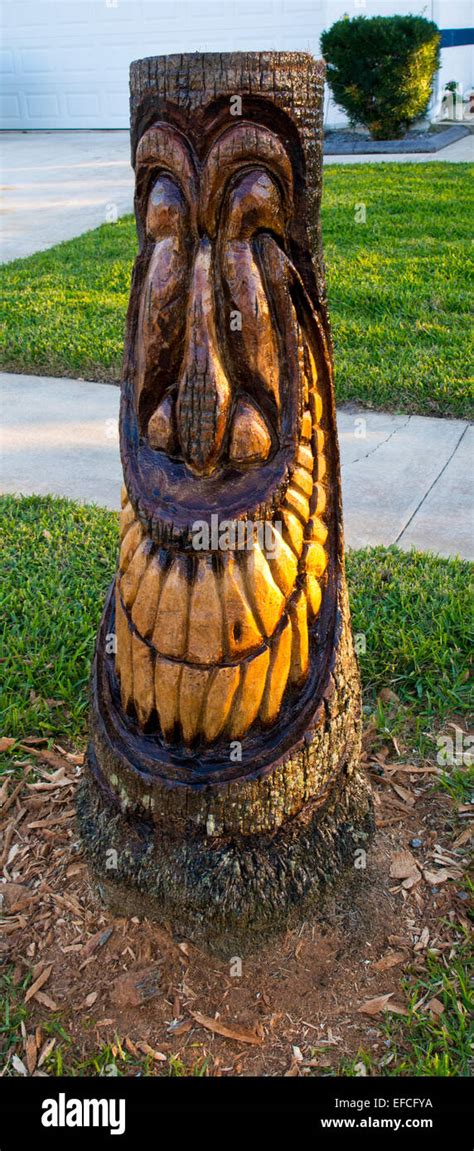 A Happy Tiki From A Palm Tree Stump Stock Photo Alamy