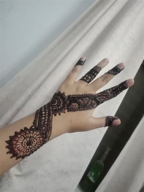 A Woman S Hand With Henna On It