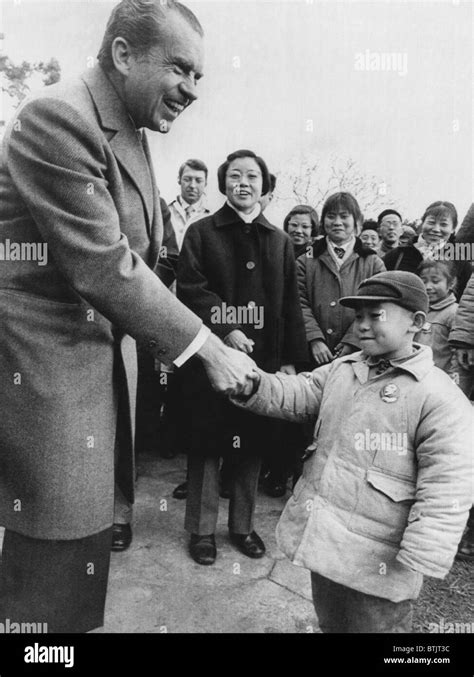 Us President Richard Nixon Shaking Hands With A Young Boy In Hangzhou