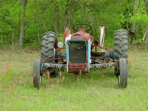 Rusty Tractor Photograph by Quwatha Valentine | Fine Art America