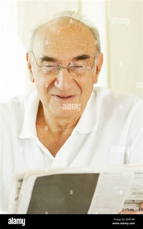 Reading A Newspaper S Hi Res Stock Photography And Images Alamy