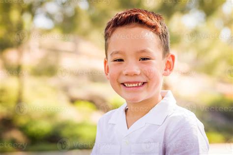 Outdoor Portrait Of A Biracial Chinese And Caucasian Boy