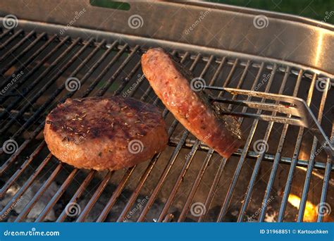 Two Hamburgers On The Barbecue Stock Image Image Of Burn Lunch 31968851