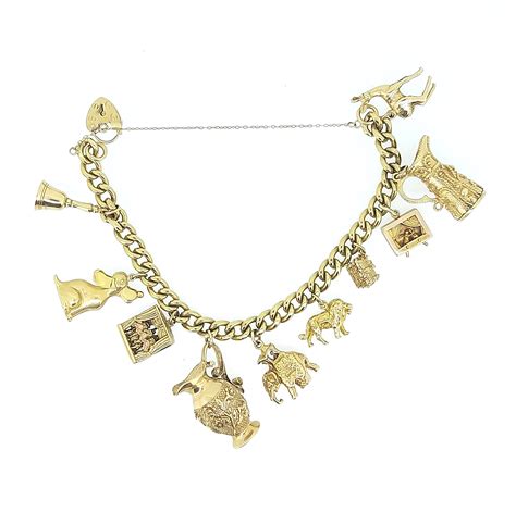 A 9ct Gold Charm Bracelet With Many Hallmarked Charms In Cheffins