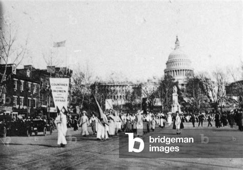 Suffrage Parade Marchers Carrying A Banner Reading Countries