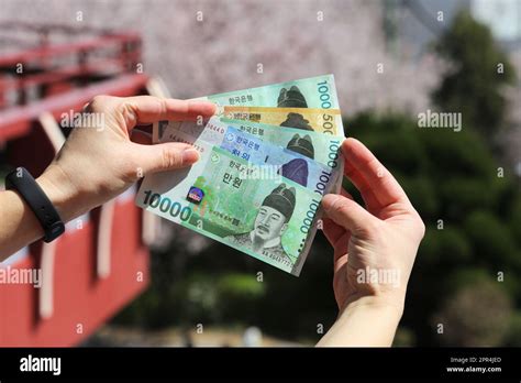 South Korean Won Currency Of South Korea Hand Holding Used Banknotes