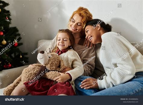 Joyful Lesbian Couple Hugs Their Daughter Stock Photo Shutterstock
