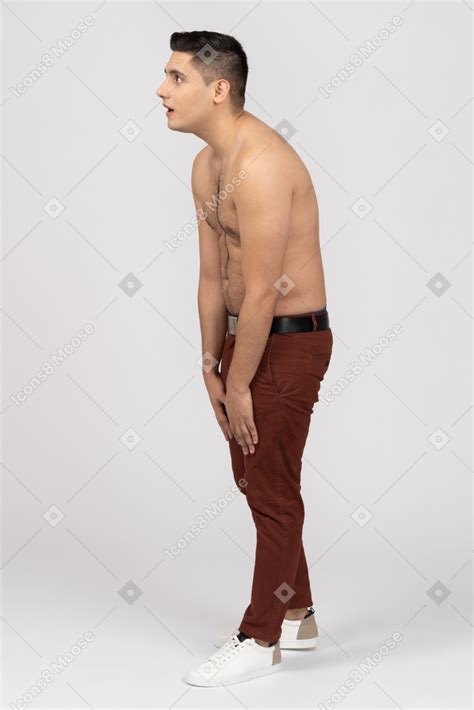 Side View Of A Shirtless Latino Man Looking Aside In Surprise Photo