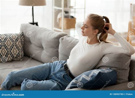 Relaxed Young Woman Resting on Comfortable Couch Relaxing Breathing Air ... 