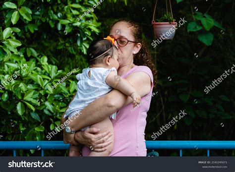 Aunt Red Haired Latina Woman Kissing Stock Photo 2141245071 Shutterstock