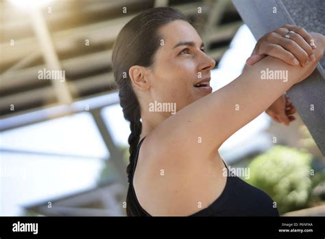 Brunette Fitness Girl Stretching After Exercising Stock Photo Alamy