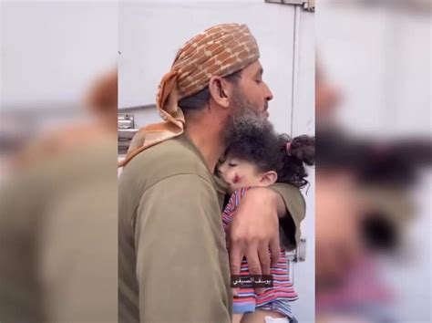 Palestinian Father Bids Farewell To His Daughter Embracing Her In A