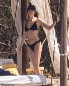 Dakota Johnson Shows Off Her Figure In A Black Bikini As She Joins