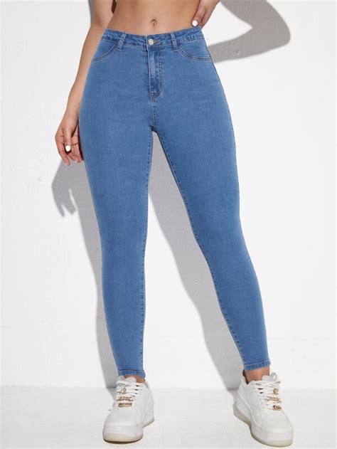 SHEIN Essnce Jeans Ajustados Con Bolsillo Oblicuo Moda De Mujer