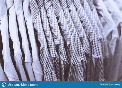 Row Of Shirts Hanging On Rack In Shop Stock Photo Image Of Gray