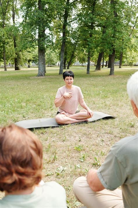 Mature Woman Holding Classes Outdoors Stock Photo Image Of Practicing