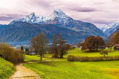 Premium Photo Green Bright Meadow And Famous Watzmann Mountain