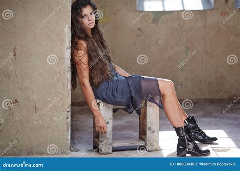 Beautiful Brunette Woman Sitting On Chair Stock Photo Image Of Enigmatic Long 108803438