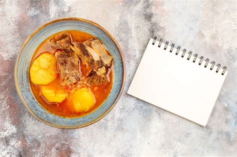 Free Photo Top View Bozbash Soup A Notebook On Nude Background