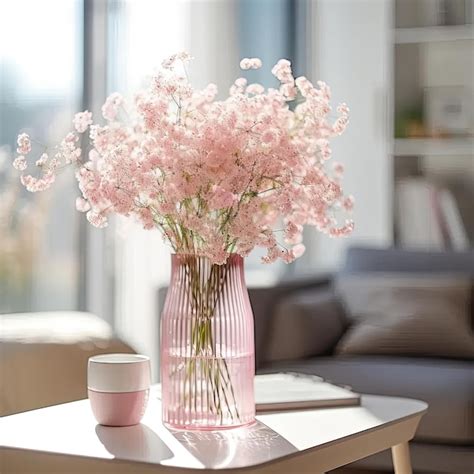 Premium Photo A Pink Vase Filled With Pink Flowers On Top Of A Table