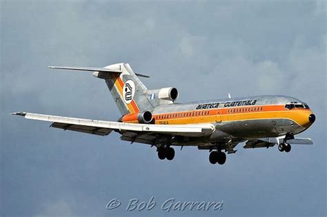 An Orange And Silver Jet Airliner Flying In The Sky With It S Landing