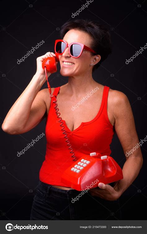 Mature Beautiful Woman With Short Hair Against Black Background Stock Photo Amazingmikael