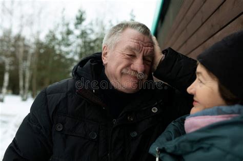 Cute Mature Couple Talking To Each Other While Looking Down The Street Stock Photo Image Of
