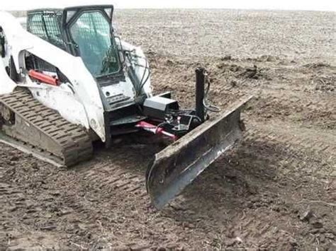 Heavy equipment management software: Skid steer dozer blade attachment