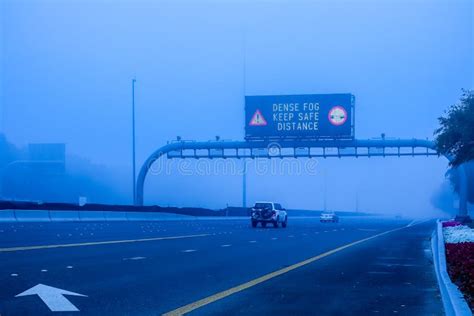 Road In The Fog Sign Mention Keep Distance For Motorists At Dubai Road