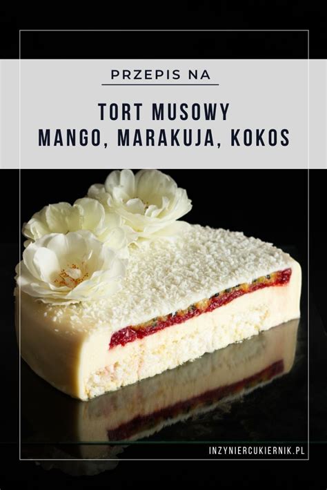 A Piece Of Cake With Flowers On Top And The Words Tort Musoy Mango