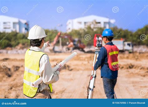 Construction Engineer With Foreman Worker Checking Site Stock Photo