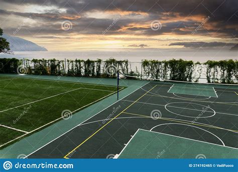 Outdoor Volleyball Court With A Net In The Morning Next To The Sea