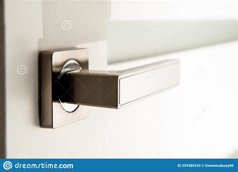 Modern Metal Door Handle on White Door Stock Photo - Image of knob, doorhandle: 259389334