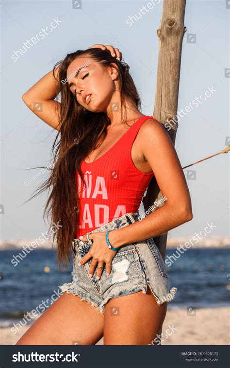 Beautiful Sexy Brunette Girl Denim Shorts Stock Photo