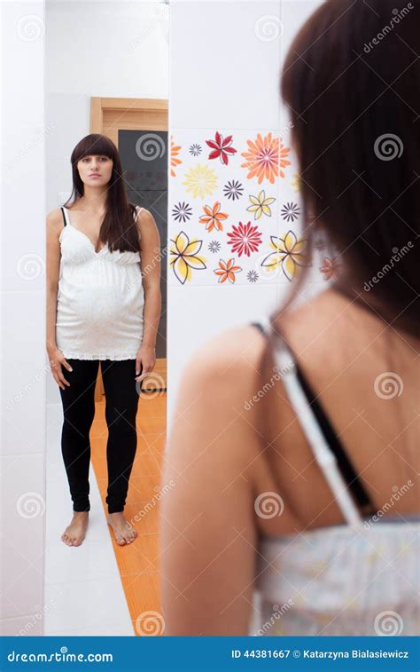 Pregnant Woman Looking In Mirror Stock Image Image Of Abdomen Fertility 44381667